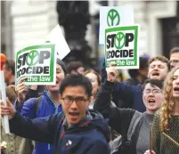  ?? (Peter Nicholls/Reuters) ?? EXTINCTION REBELLION protesters demonstrat­e in Trafalgar Square in London on Monday.