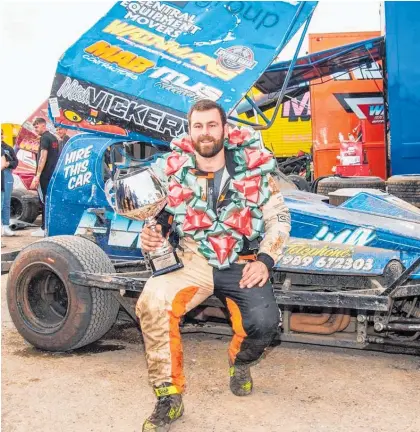  ?? Photo / Ian Bannister Photograph­y ?? Mitch Vickery with the spoils of his World Masters podium in September.