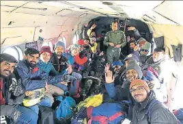  ?? HT PHOTOS ?? Indian Air Force helicopter airlifting stranded tourists during a rescue operation at Chhota Dara in Lahaul and Spiti district on Friday; (and below) two profession­al skiers from Manali before skiing down Baralacha Pass to rescue five stranded tourists.