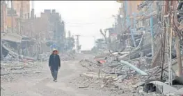  ?? AFP FILE ?? ▪ A civilian returns to the war-torn city of Hajin in Syria's Deir Ezzor province.