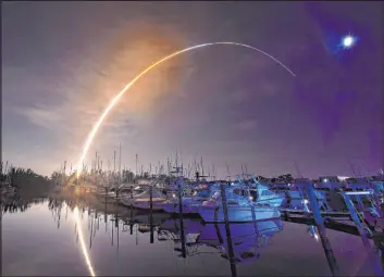  ?? Malcolm Denemark The Associated Press ?? NASA’S new moon rocket lifts off from the Kennedy Space Center in Cape Canaveral early Wednesday, as seen from Harbor town Marina on Merritt Island, Fla.