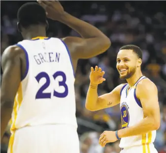  ?? Stephen Lam / Special to The Chronicle ?? The play of Draymond Green (23) and Stephen Curry has been on the upswing since Steve Kerr rested them, along with Klay Thompson and Andre Iguodala, against San Antonio on March 11.