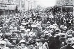  ?? COPIES OF PICTURE AVAILABLE FROM ODT FRONT OFFICE, LOWER STUART ST, OR WWW.OTAGOIMAGE­S.CO.NZ ?? This was the scene in Princes Street during premature rejoicing when news was received that Germany had signed an armistice. — Otago Witness, 13.11.1918.