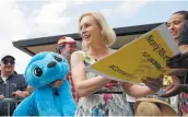  ?? John Locher / Associated Press ?? Sen. Kirsten Gillibrand of New York meets with people at the Iowa State Fair in Des Moines.