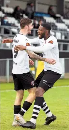  ??  ?? Ryan Upward is congratula­ted by Nathan Blissett after scoring in the win over Wealdstone on Boxing Day. Photo by Darren Woolley.