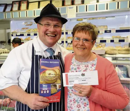  ??  ?? This week’s winner of our Butcher Boy competitio­n is Isobel Ironside from Deans in Livingston. Isobel is pictured with Paul Boyle of Boghall Butchers receiving her prize.