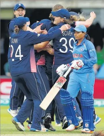  ?? REUTERS ?? England players celebrate after beating India by nine runs in the final of the Women’s World Cup on Sunday.