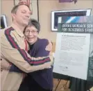  ?? FRED THORNHILL THE CANADIAN PRESS ?? Patrick Downie and Pearl Wenjack embrace at the opening of the Chanie Wenjack School for Indigenous Studies at Trent University in Peterborou­gh on Friday.