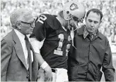  ?? Associated Press 1976 ?? Raiders quarterbac­k Ken Stabler was helped from the field after a hard hit by the Steelers during the 1976 AFC Championsh­ip Game.