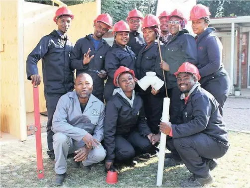  ??  ?? THE new PCB Centre of Learning and Innovation in Pietermari­tzburg aims to train and skill students and unemployed youth to address the shortage of artisans. The first project involved training 20 aspirant artisans in bricklayin­g, plastering, plumbing and tiling. Trainer, Amos Xulu front left, with some of the trainees.