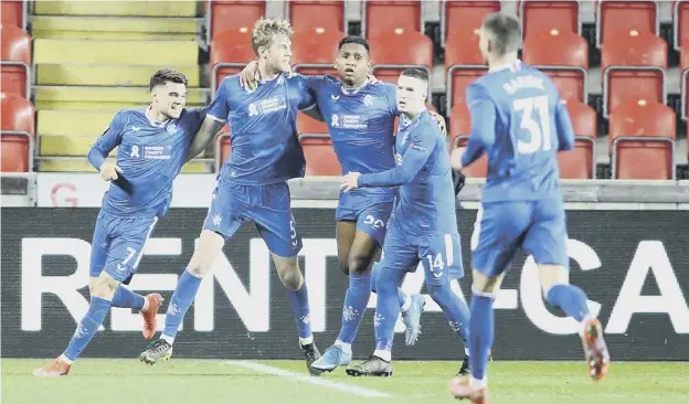  ??  ?? 0 Rangers players celebrate Filip Helander’s equaliser in the 1-1 draw against Slavia Prague in the first leg of their Europa League round-of-16 tie