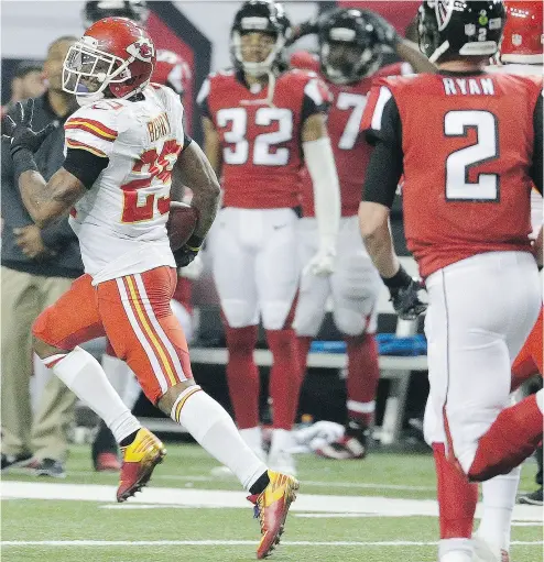  ?? CHUCK BURTON / THE ASSOCIATED PRESS ?? Kansas City Chiefs strong safety Eric Berry runs back an intercepti­on for a two-point conversion against the Atlanta Falcons Sunday for what proved to be the winning points in a 29-28 Kansas City victory.