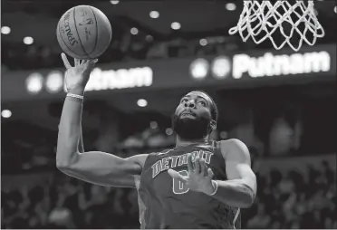  ?? MICHAELY DWYER/AP PHOTO ?? Detroit’s Andre Drummond goes up for a dunk during the Pistons’ 118-108 win over the Celtics on Monday night in Boston. The ex-St. Thomas More and UConn great had 26 points and 22 rebounds.