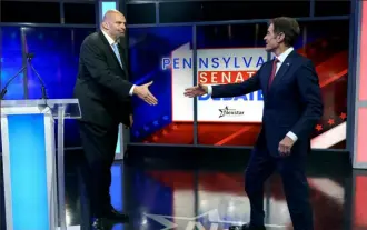  ?? Greg Nash/The Hill/Nexstar ?? Lt. Gov. John Fetterman, left, and Mehmet Oz shake hands prior to the Nexstar Pennsylvan­ia Senate Debate on Oct. 25 in Harrisburg.