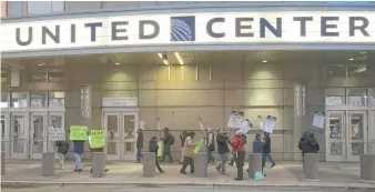  ?? SUN-TIMES FILE ?? Food service workers picket outside the United Center on Dec. 7.