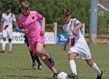  ??  ?? Robert Bulmer of Wexford F.C. looks on as a Galway United opponent delivers a pass.