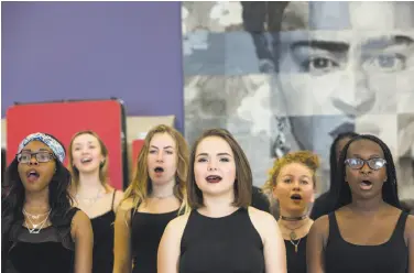  ?? Photos by Erin Lubin / Special to The Chronicle ?? Above, members of Vocal Rush, an a cappella group at Oakland School for the Arts, get their voices in shape for the Friday, May 8, show at the Fox Theater. Right: Nelly Ake, 16, performs her part during a rehearsal for “Caravan.”