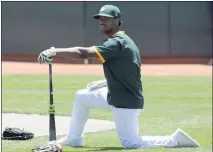  ?? ANDA CHU — BAY AREA NEWS GROUP ?? The A’s Khris Davis waits to bat during a summer camp workout at the Coliseum in Oakland on Tuesday.