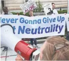  ??  ?? Supporters of stricter Net-neutrality rules protest FCC Chairman Ajit Pai’s arrival at the American Enterprise Institute in Washington, D.C., last May. CHIP SOMODEVILL­A/GETTY IMAGES