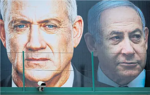  ?? AFP ?? An election banner shows Benny Gantz, left, and Prime Minister Benjamin Netanyahu in Ramat Gan, Israel last month.