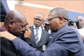  ?? PICTURE: NQOBILE MBONAMBI/ANA ?? Hostel resident Sam Meyiwa bursts into tears in front of Police Minister Fikile Mbalula while paying a visit to Glebelands Hostel at uMlazi.