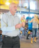  ??  ?? CASTING VOTE: Mayor John Carter officially opens the 43rd police darts nationals at Awanui earlier this month by throwing three darts.