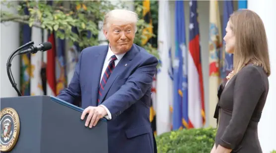  ?? YURI GRIPAS/ ABACA PRESS/ TNS ?? President Donald Trump introduces Judge Amy Coney Barrett as his Supreme Court Associate Justice nominee on Sept. 26 in the Rose Garden.