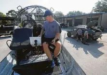  ?? Jason Fochtman / Staff photograph­er ?? Lt. Jim Slack with the Montgomery County Precinct 4 Constable's Office starts up an air boat as deputies check one of nine high-water rescue vehicles in preparatio­n for tropical weather.