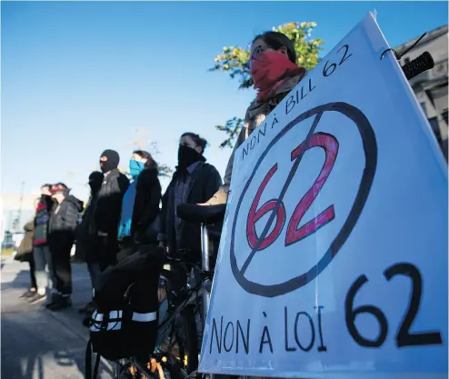  ?? CHRISTINNE MUSCHI / POSTMEDIA NEWS FILES ?? Protesters in a demonstrat­ion against Quebec’s Bill 62 in Montreal in October.