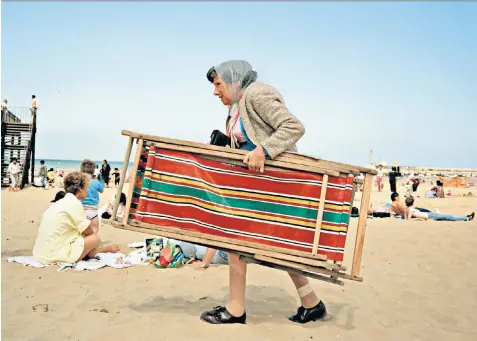  ??  ?? Life’s a beach: Martin Parr’s 1986 picture of Broadstair­s, left; and Parr’s West Bay (Seagulls Eating Chips) from 1997, right