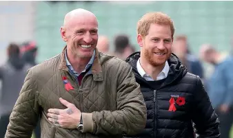  ?? AP ?? Former Wales rugby captain Gareth Thomas, left, is pictured with Prince Harry at a Terrence Higgins Trust event in 22019.