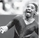  ?? CHARLIE RIEDEL/AP ?? Simone Biles celebrates after competing in the uneven bars to win the all around senior women’s competitio­n at the U.S. Gymnastics Championsh­ips on Sunday.