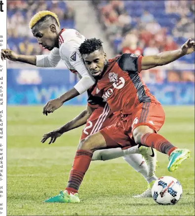  ?? AP ?? LEGGING IT OUT: Red Bulls defender Michael Amir Murillo (left) battles Toronto’s Raheem Edwards for possession of the ball during the teams’ 1-1 draw at Red Bull Arena on Friday night.