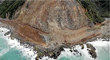  ?? PHOTO: SUPPLIED ?? Excavators working from either side of Ohau Point meet in the middle to open an access track for the first time since the earthquake.