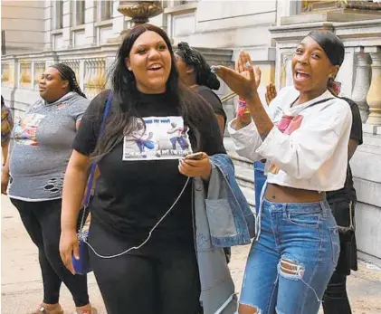  ?? LLOYD FOX/BALTIMORE SUN ?? Family and friends of Taylor Hayes outside the courthouse Wednesday after Keon Gray was found guilty of second-degree murder.