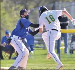  ?? KYLE FRANKO — TRENTONIAN PHOTO ?? West Windsor North first baseman Jahan Kulkarni, left, tags out West Windsor South’s Owen McCarron in the second inning during a CVC baseball game on Tuesday afternoon.