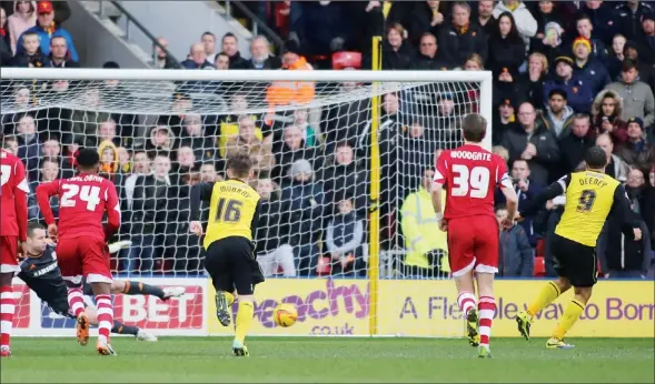  ?? PICTURES: Action Images ?? SPOT ON: Troy Deeney scores the only goal of the game for Watford with a penalty