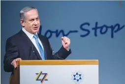  ?? ( Yonatan Sindel/ Flash90) ?? ISRAELI POLITICOS treat the World Zionist Congress like a billion- dollar cash cow. Pictured: Prime Minister Benjamin Netanyahu speaks during the 37th WZC at the Jerusalem Internatio­nal Convention Center in 2015.