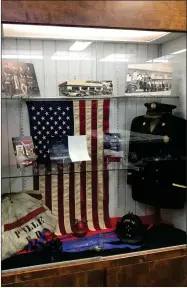  ?? RECORDER PHOTO BY CHARLES WHISNAND ?? The Portervill­e Historical Museum’s library exhibit features a tribute to firefighte­rs that includes a turn of the century leather fire hat.