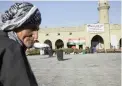  ?? PICTURE: AP ?? CHOICE: A man sits in centre of Erbil, Kurdistan region, near a campaign poster urging people to vote ‘yes’ in a poll on independen­ce from Iraq.