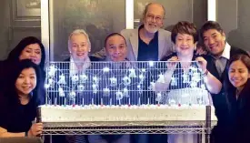  ??  ?? POSING behind the unique, long birthday cake for celebrator­s Annie Sarthou (third from left) and Ambeth Ocampo (second from right) are, from left, Sandy Tan-Uy, June Rufino, Dr. Nestor Pagulayan, National Artist BenCab, Virgie Ramos and Gina Garcia.