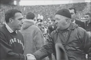  ?? ASSOCIATED PRESS FILE PHOTO ?? In this Nov. 19, 1966, photo, Notre Dame football coach Ara Parseghian, left, shakes hands with Michigan State coach Duffy Daugherty after their 10-10 tie in East Lansing, Mich.