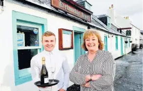  ??  ?? Proud moment Dorothy Birks and waiter Adam Lawrie celebratin­g their Trip Advisor Award of Excellence