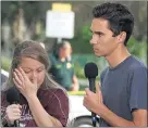  ?? MARK WILSON —GETTY IMAGES ?? From left, students Kelsey Friend and David Hogg discuss themass shooting at theMarjory Stoneman Douglas High School in Florida.