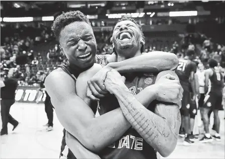  ?? ANDY LYONS PHOTO ?? Mfiondu Kabengele of the Florida State Seminoles celebrates with Braian Angola after defeating the Xavier Musketeers.