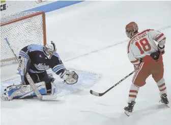  ?? STAFF PHOTO BY NICOLAUS CZARNECKI ?? BEAR-ING DOWN: Maine goalie Jeremy Swayman makes a save on Boston University forward Jordan Greenway last night at Agganis Arena. The Bruins draft pick made 31 saves to record his first career shutout.