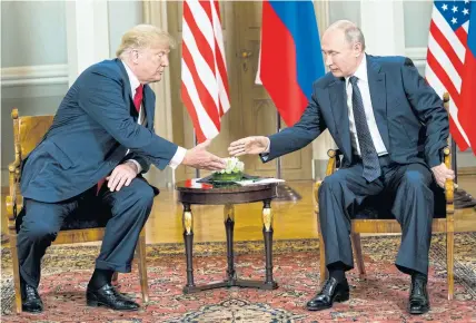  ??  ?? LET’S DO IT AGAIN: President Donald Trump meets his counterpar­t Vladimir Putin earlier this month. Just two days after the White House postponed plans to have Mr Putin visit Washington, the Russian leader said he had invited Mr Trump to visit him in...