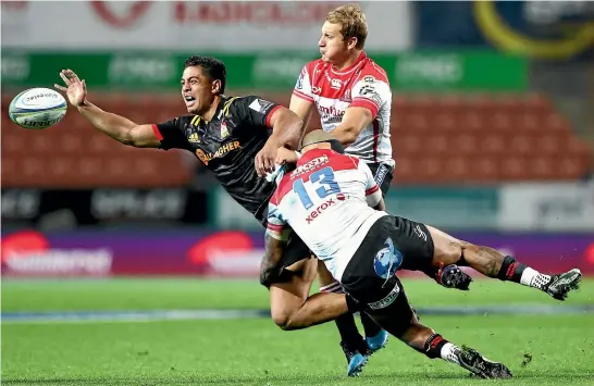  ?? GETTY IMAGES ?? Chiefs midfield back Anton Lienert-Brown is hit hard in a tackle by determined Lions defence during the Super Rugby match in Hamilton last night.