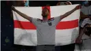  ??  ?? England fans who attended the quarterfin­al were effectivel­y banned from the semifinal by by travel restrictio­ns.