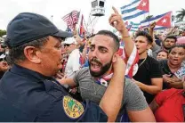  ?? Wilfredo Lee / Associated Press file photo ?? Miami Police Chief Art Acevedo hugs a demonstrat­or during a July rally. City commission­ers held a special meeting Monday in which they blasted Acevedo.